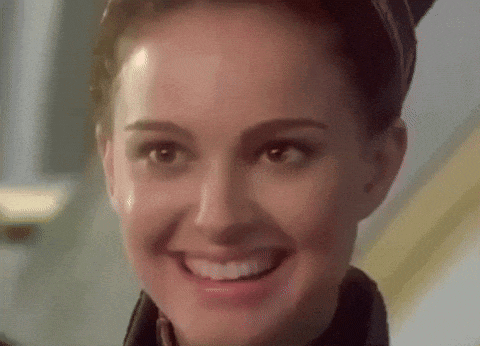 a close up of a woman 's face with a smile on it