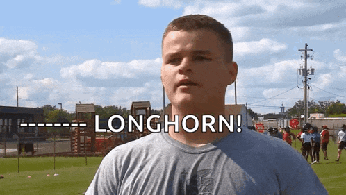 a man in a gray shirt says longhorn