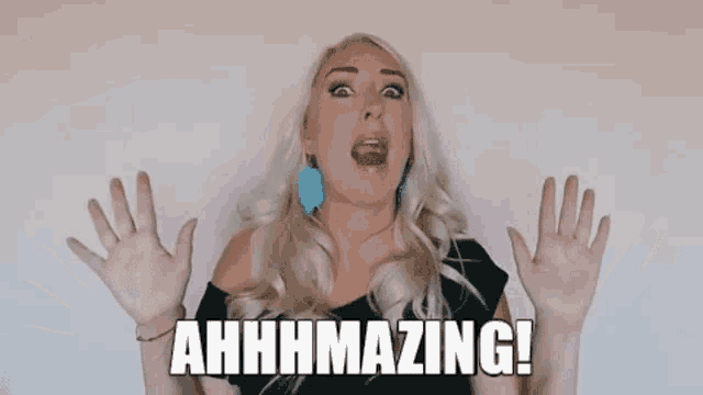 a blonde woman is holding her hands up in the air and saying ahhhhmazing !