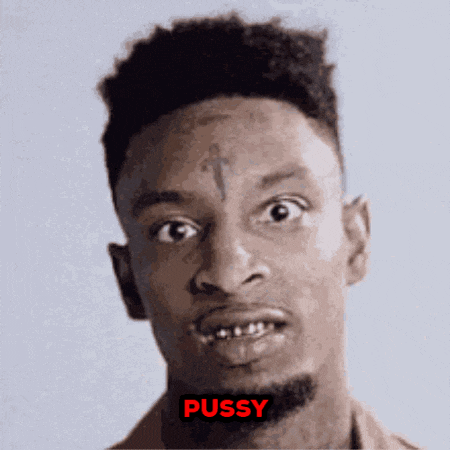 a man with a cross tattoo on his forehead has the word pussy written on his face