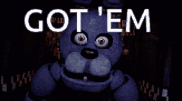 bonnie from five nights at freddy 's is standing in the dark with the words got ' em behind him .