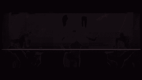 a woman in a black dress is dancing in front of a swirl of lights .