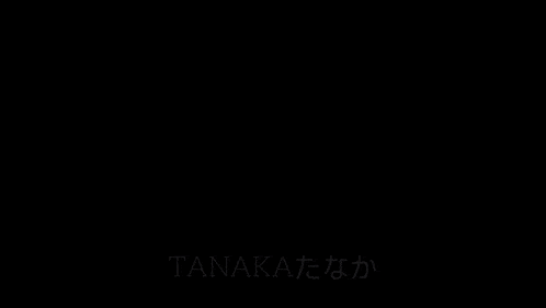 a black and white photo of a man with the word tanaka written on the bottom right