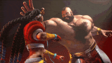 a man with a beard is being punched by a woman
