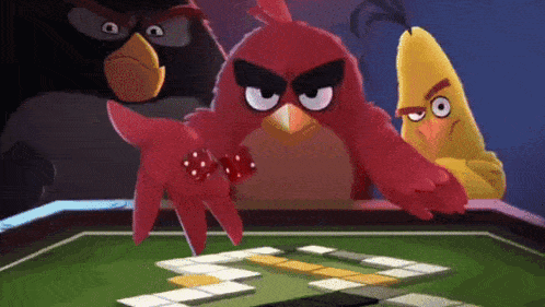 three angry birds are playing a game with dice