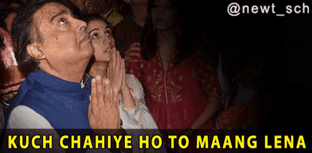 a man and a woman are praying in front of a crowd with the caption kuch chahaye ho to maang lena