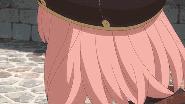 a close up of a girl 's pink skirt with a gold buckle