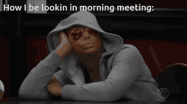 a woman wearing sunglasses and a hooded jacket with the words how i be lookin in morning meeting
