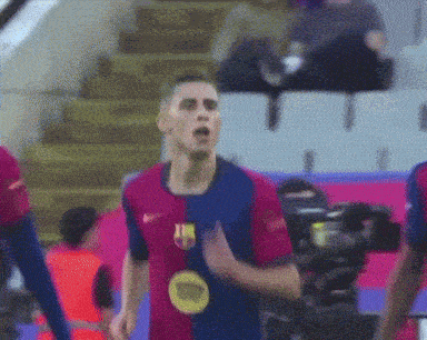a soccer player wearing a jersey that says fcb on it
