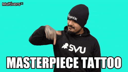 a man wearing a black hoodie that says masterpiece tattoo on it
