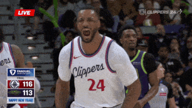 a basketball player in a clippers jersey celebrates