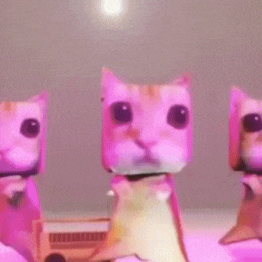three paper cats are standing next to each other