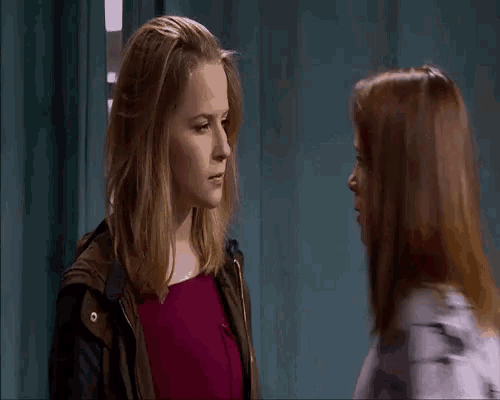 two women are standing next to each other and the word peste is on the screen behind them