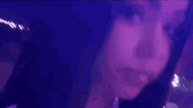 a close up of a woman 's face with the word exotic written in white