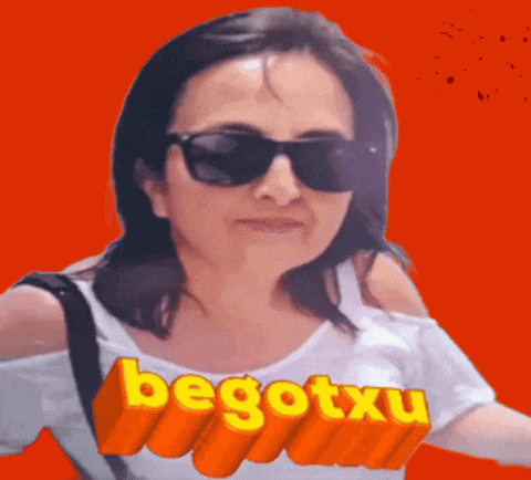 a woman wearing sunglasses and a white shirt with the word begotxu on it