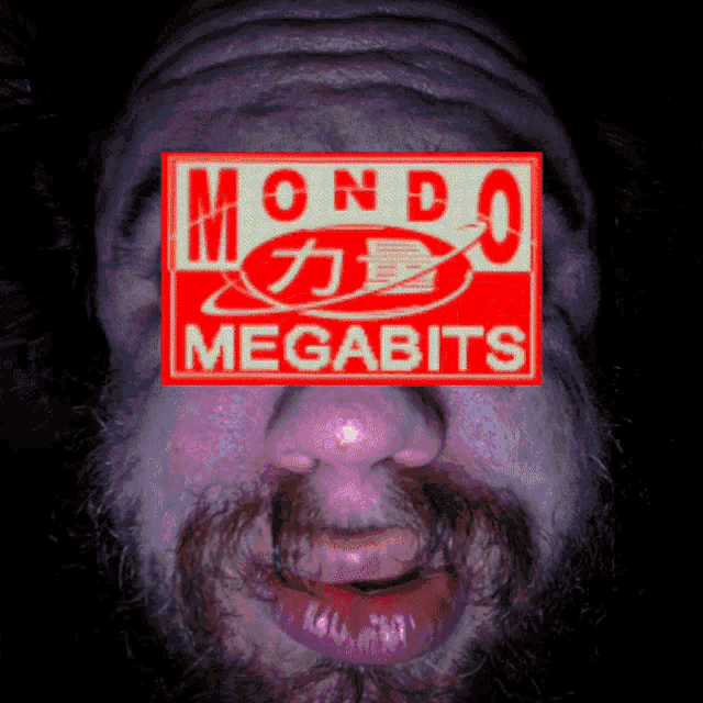a close up of a man 's face with a mondo megabits logo on it