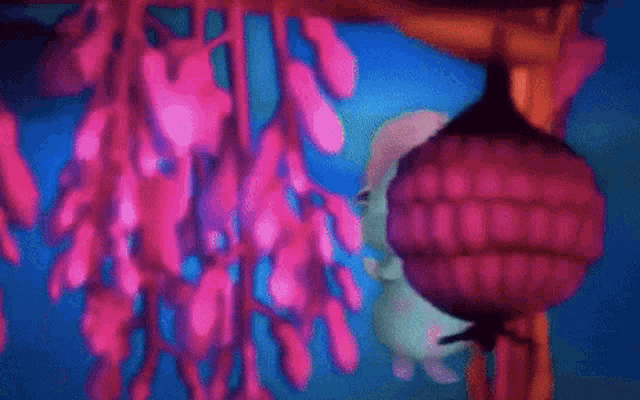 a cartoon fairy is hanging from a tree branch in the water