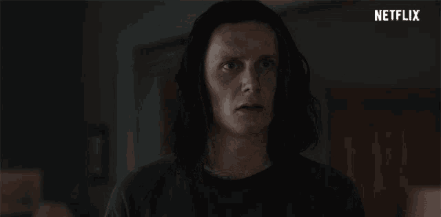 a man with long hair is asking what happened in a netflix advertisement .