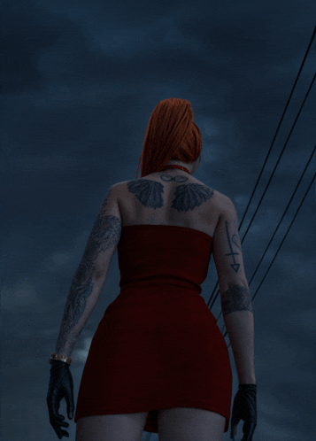 a woman in a red dress has a tattoo on her back that says " infinity "
