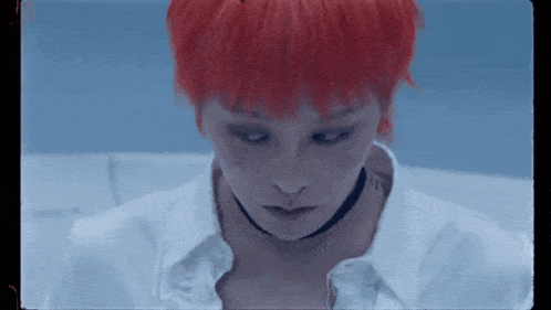 a close up of a person with red hair