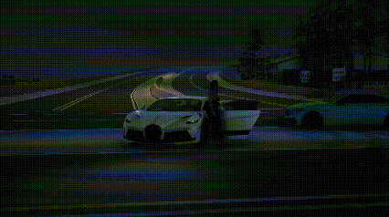 a man is standing next to a white car on the side of a road .