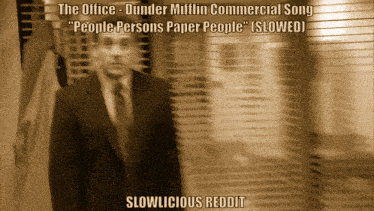 a blurred image of a man in a suit and tie with slowlicious reddit written below him