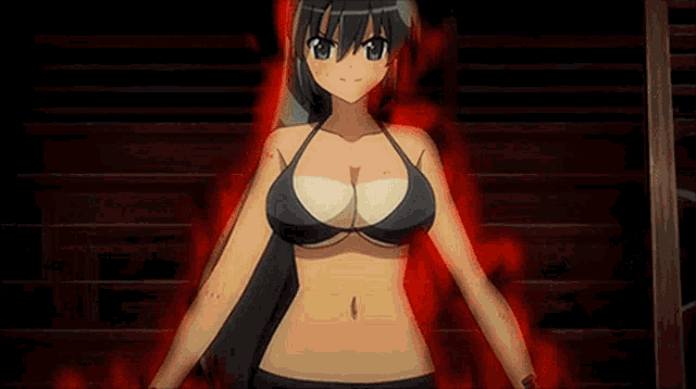 a woman in a bikini is standing in a dark room holding a sword in her hands .