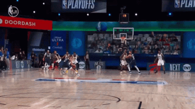 a basketball game is being played on a court with a sign that says playoffs