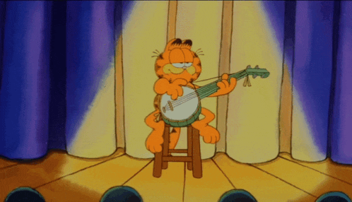garfield playing a banjo on a stage in front of an audience