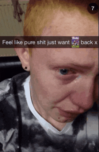 a screenshot of a man 's face that says " feel like pure shit just want back "
