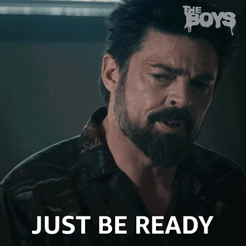 a man with a beard and a shirt that says just be ready on it