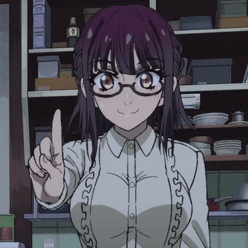 a girl with glasses is pointing her finger at something in a kitchen