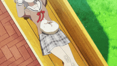 a girl in a school uniform is laying on a bench