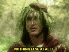 a man with a crown of ferns on his head is asking nothing else at all .