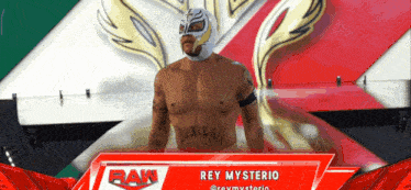 a wrestler named rey mysterio stands on a podium