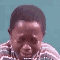 a close up of a person 's face with the words `` oh my god '' written on the bottom .