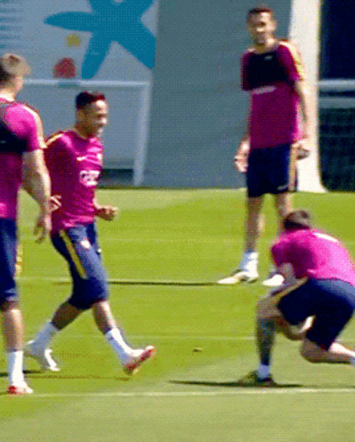 a soccer player wearing a pink shirt with the letters fcb on it