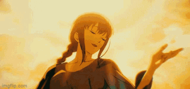 a woman in a long dress is standing in front of a sunset sky .