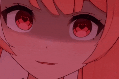 a close up of a girl 's face with red heart shaped eyes