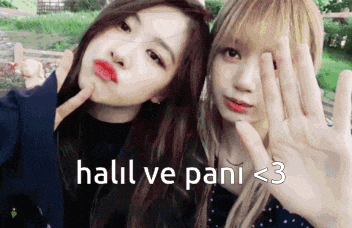two girls are posing for a picture with the words hall ve pani < 3