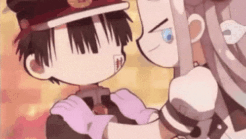 a boy and a girl are standing next to each other and hugging each other .