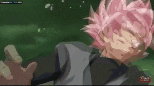 a cartoon character with pink hair is laying down in a green field .