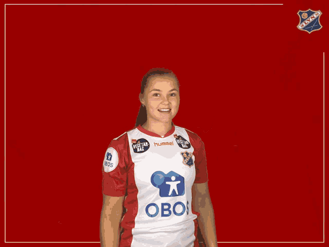 a woman giving a thumbs up wearing a jersey that says obos on it