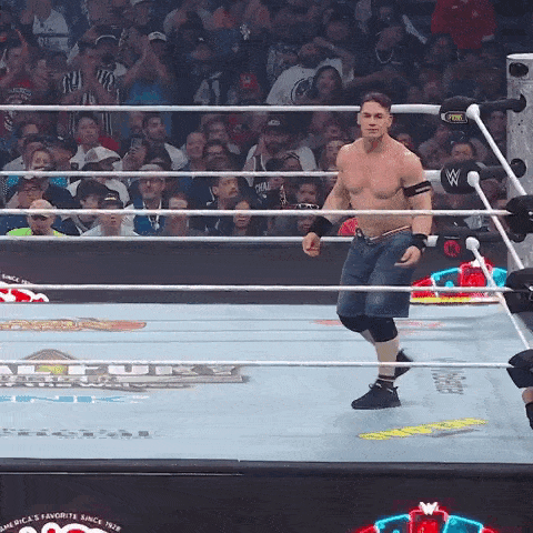 a man in a wrestling ring with a fox logo on the ring