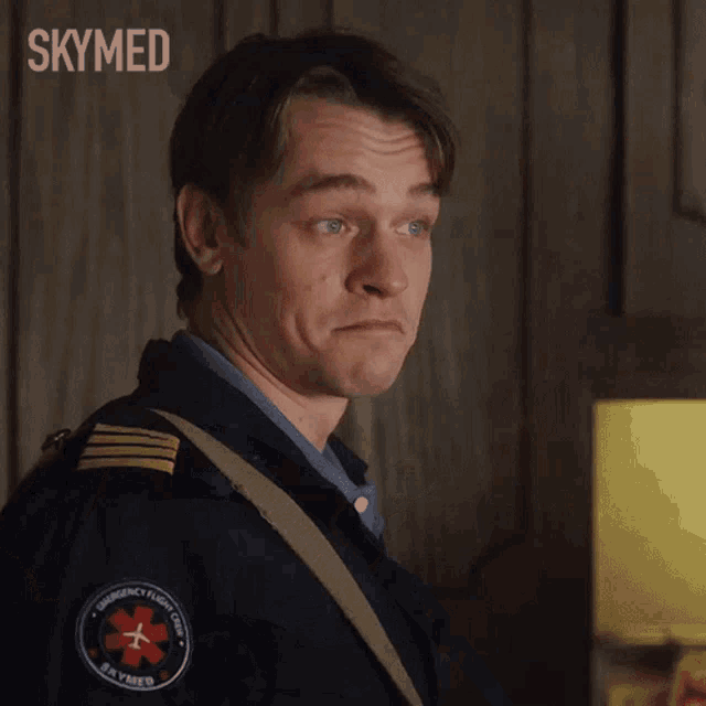 a man in a military uniform is making a funny face with the words skymed behind him