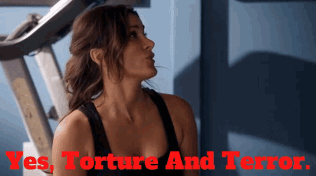 a woman in a black tank top with the words yes torture and terror