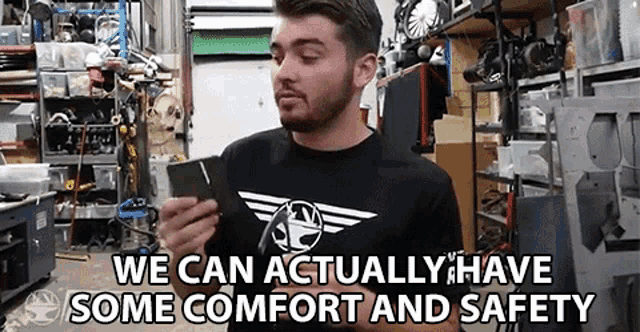 a man in a black shirt says we can actually have some comfort and safety while holding a cell phone