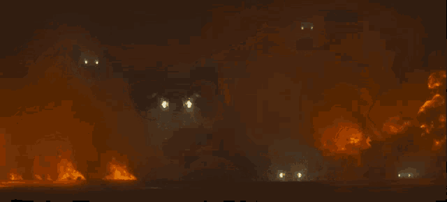 a group of planes are flying over a fire