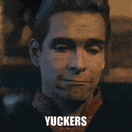 a close up of a man 's face with the word yuckers on the bottom