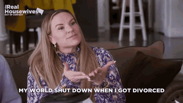 a woman is sitting on a couch with the words " my world shut down when i got divorced "